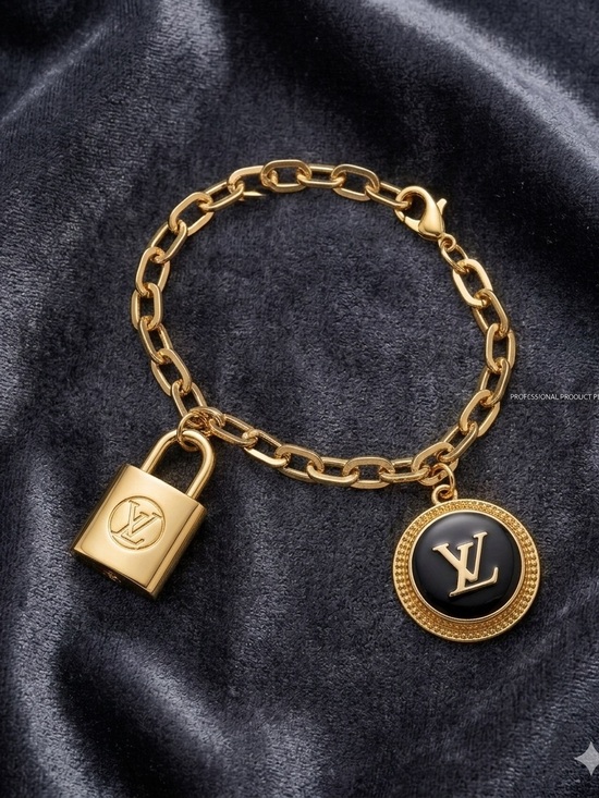 Louis Vuitton. Jewelry - LV Gold Chain Bracelet with Black Logo Disc and Padlock